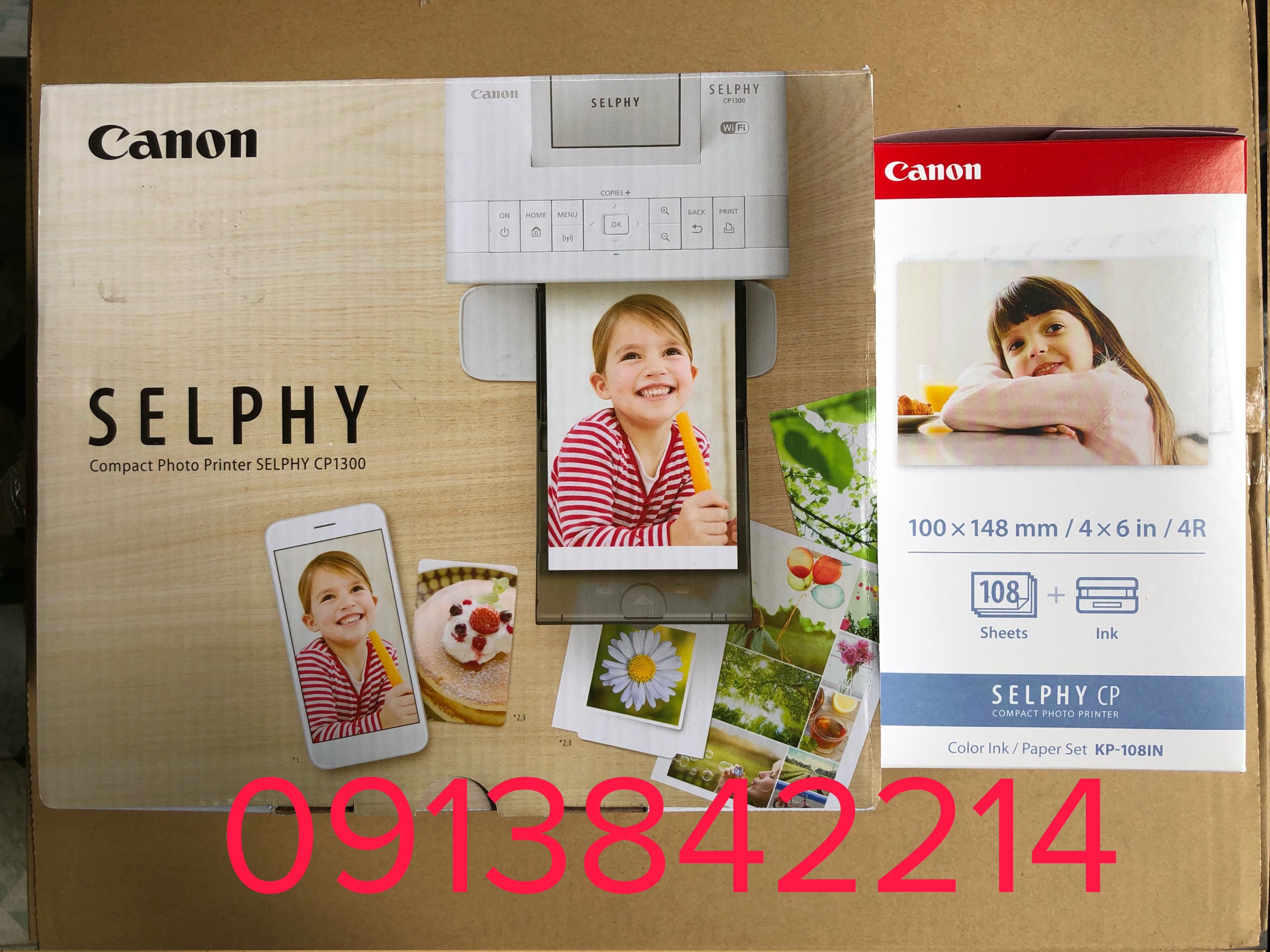Máy in ảnh Canon CP1300 wifi new (shelphy cp1300)+ 3 hộp mực và 108 tờ giấy cumbo